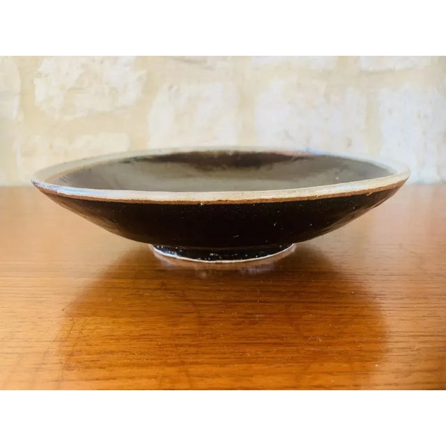 Mid-century, vintage, glazed earthenware bowl from California, circa 1960’s Piece features a very cool design of the...