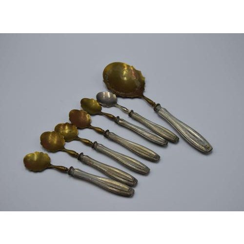 Precious ice cream set is a set of dessert cutlery realized in 19th century. Sterling silver and brass. The lot consist in...