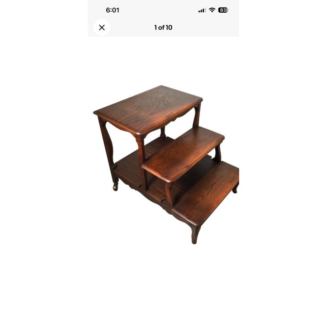 Solid quarter sewn oak construction library steps with natural wood grain medium brown satin finish It has small caster...