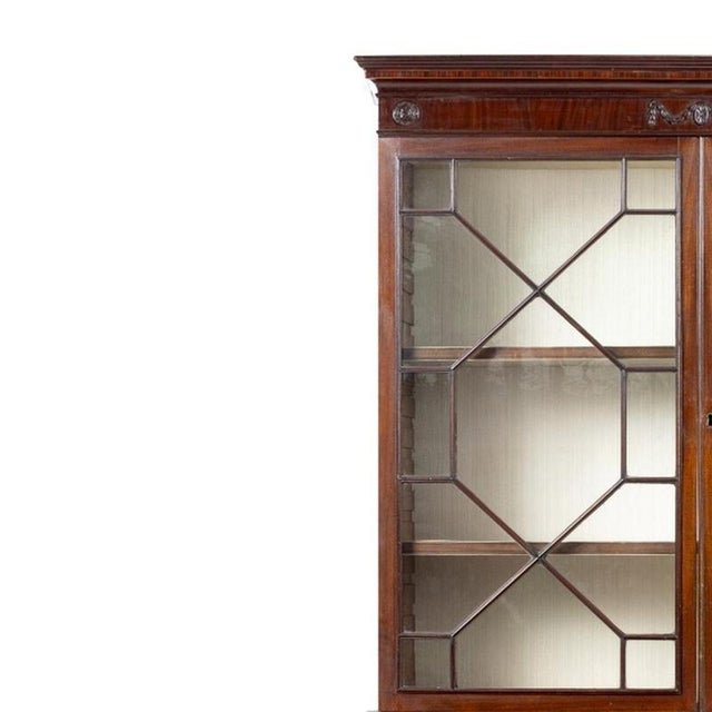 Furniture - Bookcase with desk drawer, George III style. English; George III; in mahogany wood. Features a raised cornice...