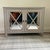 Greene & Co Cupboard The winter gray finish is paired with gold trimmed mirrored doors giving you a stylish storage...