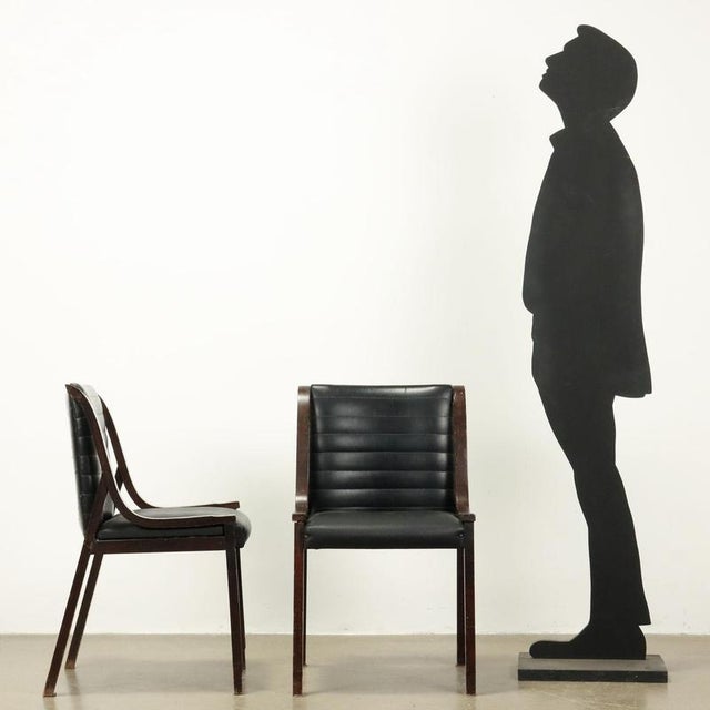 Group of 3 chairs, beech wood and curved bands, stained, seat and back in foam, upholstery in imitation leather. This...