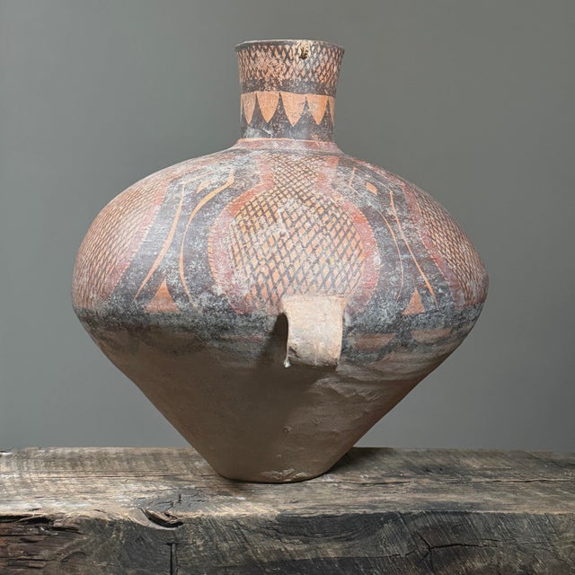 Ancient Monumental Folk Art Majiayao Hand Painted Terracotta Jar Size: 16 in. W × 14.5 in. H × 14.5 in A hand painted...