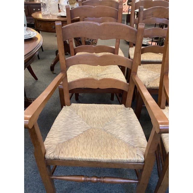 Beautiful set of English Ladder back chairs. 2 arm and 4 side chairs. Rush seats.