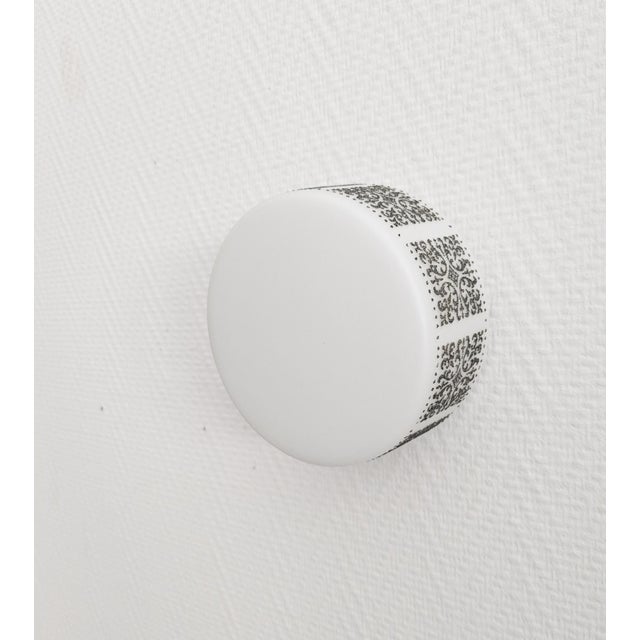 This round lamp from Limburg can be used as a wall and ceiling light. The high-quality glass shade made of opal glass with...