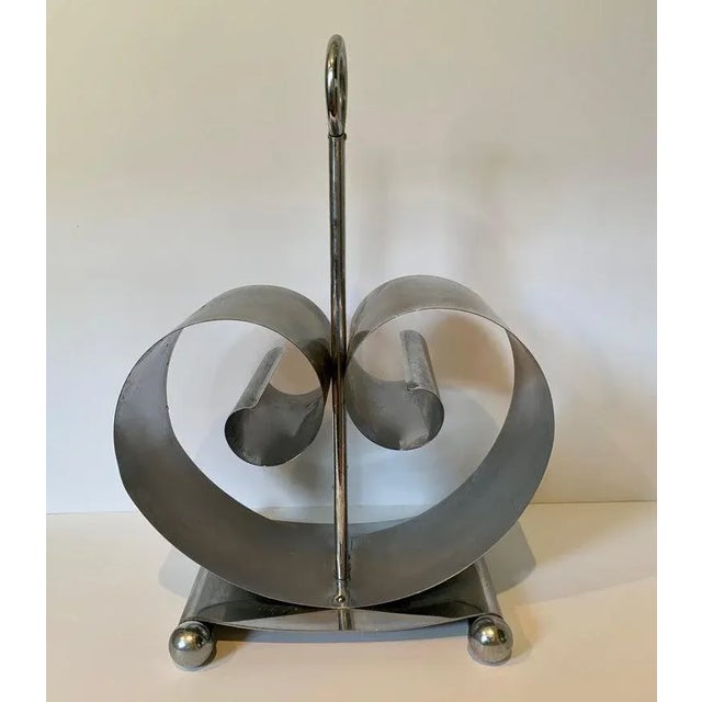Norman Bel Geddes magazine rack, midcentury magazine rack, the curled sides expand depending on the number of magazines or...