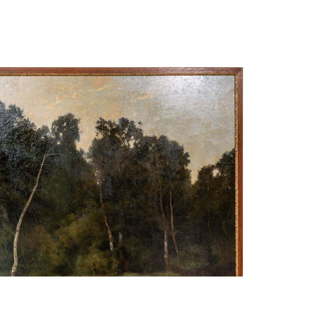 Painting with wooden frame by French artist Hector Hanoteau. Depicting a quiet outdoor nature scene. Titled "I'Eau dor...