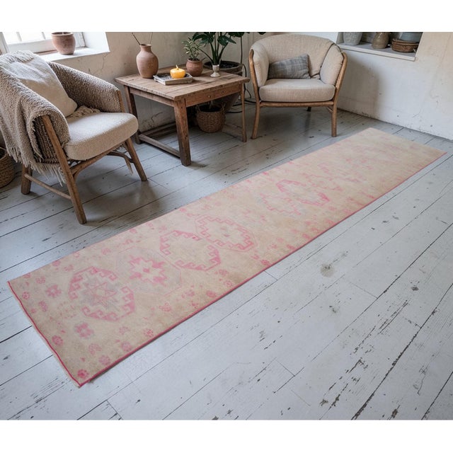 Hand-knotted in the 1960s, this Eastern Anatolian runner is a distinguished example of tribal artistry, blending mid-...
