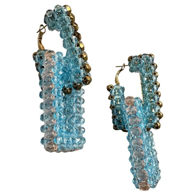 This captivating pair of earrings by Coppola e Toppo is a vibrant, contemporary creation from the 21st century, echoing...