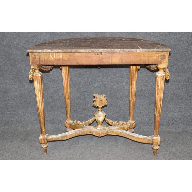 Dimensions: 35.75 inches high x 40 inches wide x 17.5 inches deep An exceptional and highly decorative 19th century French...