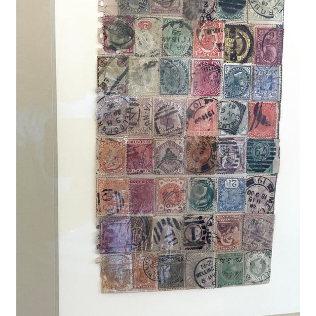 This product is a framed philatelic collection of 19th century world stamps. The set of 2 features multi-color stamps with...