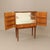 An elegant bar cabinet featuring beautifully figured flame mahogany veneer. The doors open to reveal a mirrored interior,...