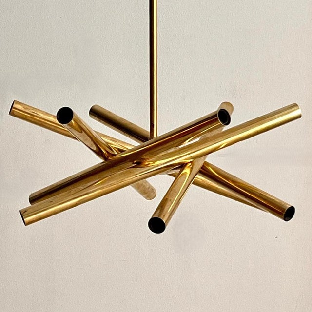 An elegant Italian-made solid brass pendant lamp dating back to the 1960s. This piece stands out for its refined,...