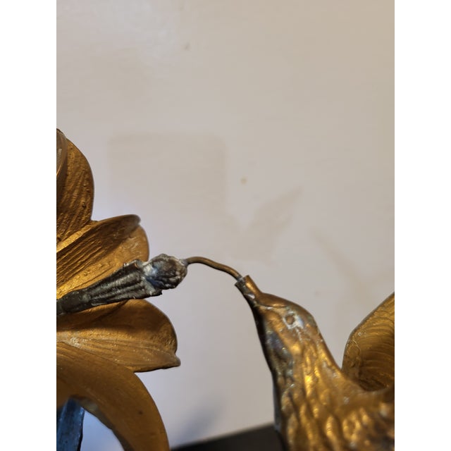 Beautiful flower sculpture featuring two flower heads and two single leaves. Sculpture is screwed into wood base.