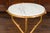 A French vintage gilt metal faux-bois inspired side table from the mid-20th century, with white veined marble top. Created...