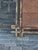 An unusual Tramp Art mirror from circa 1920 with hand-carved gilded frame and intersecting corners. Step into an opulent...