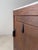 with this cabinet, everything revolves around contrast and detail. The bright white-grey marble top appears to rest almost...