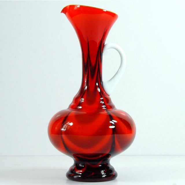 A tall, decorative glass vase in a beautiful, intense color. Designed by Carlo Moretti. Produced by the Italian Stelvia...