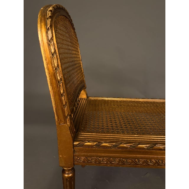 19th Century French Louis XVI Style Gilded Bench With Cane Seat and Side Armrests, Circa 1890 For Sale - Image 4 of 10
