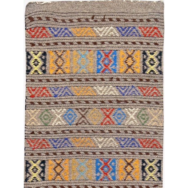 A vintage Turkish flat-woven Kilim carpet from the second quarter of the 20th century. Measures: 1' 10" x 4' 6"