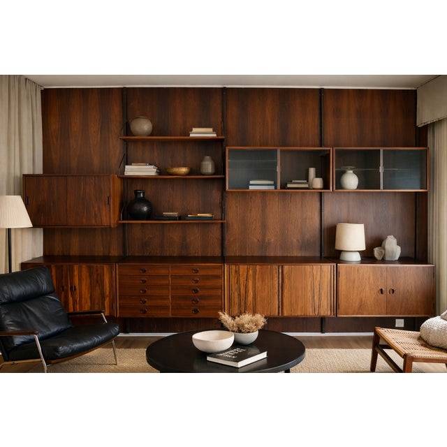 Exceptional Danish Scandinavian wall-mounted bookcase created in the 1960s. Stamped with the Danish Control label on the...