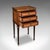 This is an antique nightstand. A French, walnut and satinwood set of bedside drawers in Louis XVI taste, dating to the...