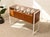 A striking Danish modern jewelry display case pairing a warm wood cabinet with a clear glass top and sleek metal frame....