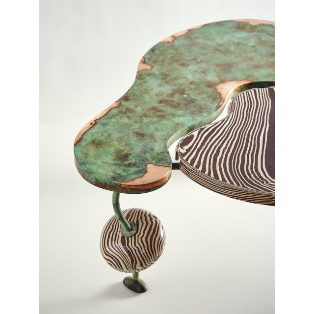 The Nimbo Coffee Table is designed to build your room around. Tessellating organic forms in a mixture of bronze and...