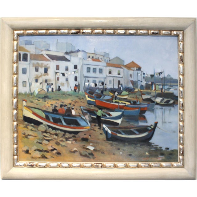 Oil painting of small colorful fishing boats in a bay. Oil on Canvas. Signed "Tanguy Le Roy" bottom right and on verso....