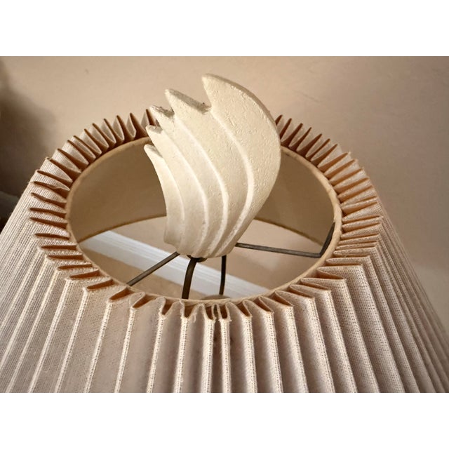 A striking mid-century coastal style embossed ceramic table lamp by renowned designer Dayle Rushall, circa 1970s....