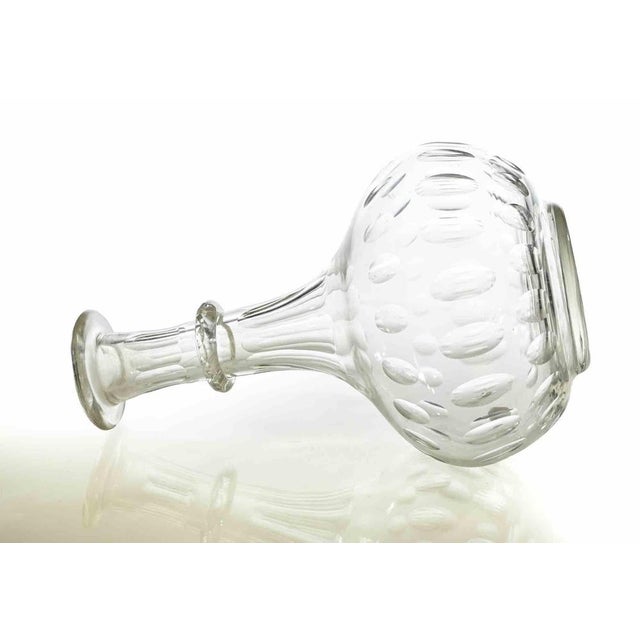 Blown and cut clear glass with faceted and oval cut decoration. Probably realized in Bohemia, in the early 20th Century....