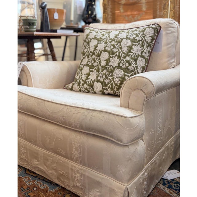 A study in contrast: classic English roll-arm proportions reimagined in custom tonal cream chinoiserie toile. Expertly...