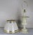 Cream alabaster urn shaped lamps with hand painted parchment shades. The lamps have been newly rewired and crowned with...