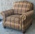 Generously proportioned club chairs by Ethan Allen. Features rolled arms, nailhead trim, tight back and bun feet. Matching...