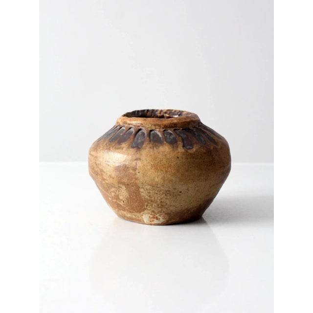 A vintage studio pottery vase dating to circa 1969. Signed by the artist, this substantial hand-crafted vessel features a...