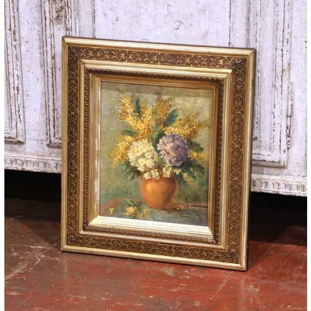 This antique floral still life painting, crafted in France circa 1880, presents a charming and decorative composition...