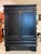 Design Plus Gallery presents a Vintage Asian-Inspired Black Wood Armoire / Storage Cabinet. This substantial wood cabinet...