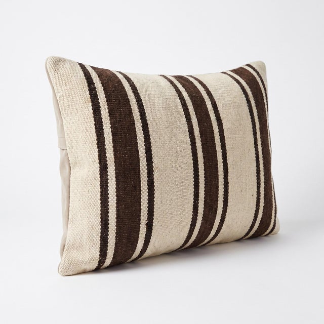 This beautiful 16'' x 24'' pillow cover was made from an authentic Turkish Kilim. Bright colors of wool adorn the front of...