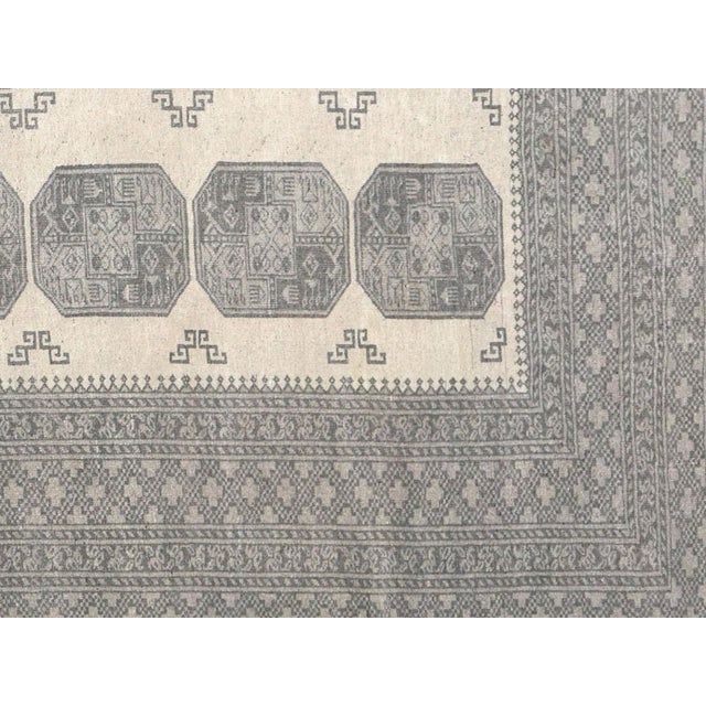 Experience the beauty and quality of a Semi Antique Afgan Beshir Rug. Handcrafted to perfection, this 10'4" x 12'7" rug is...