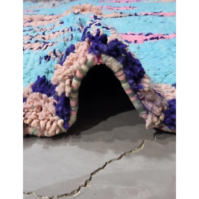 Modern Boujad Rug | Handwoven Wool Rug in Turquoise with Pink Diamond Motifs This vivid modern Boujad rug sets a scatter...