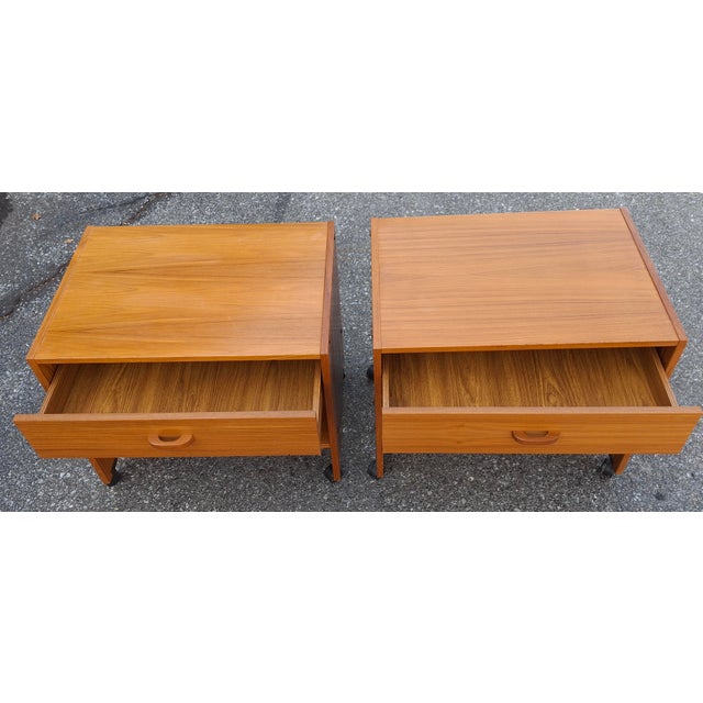 Pair Scandinavian Modern Teak Tiered Rolling Side Tables or Nightstands Measures 24.75" in width, 18" in depth and 21.5"...