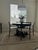 Pottery Barn 48” blackeded Oak Dining Table. In excellent condition. Four Restoration Hardware Cane Back Dining Chairs in...