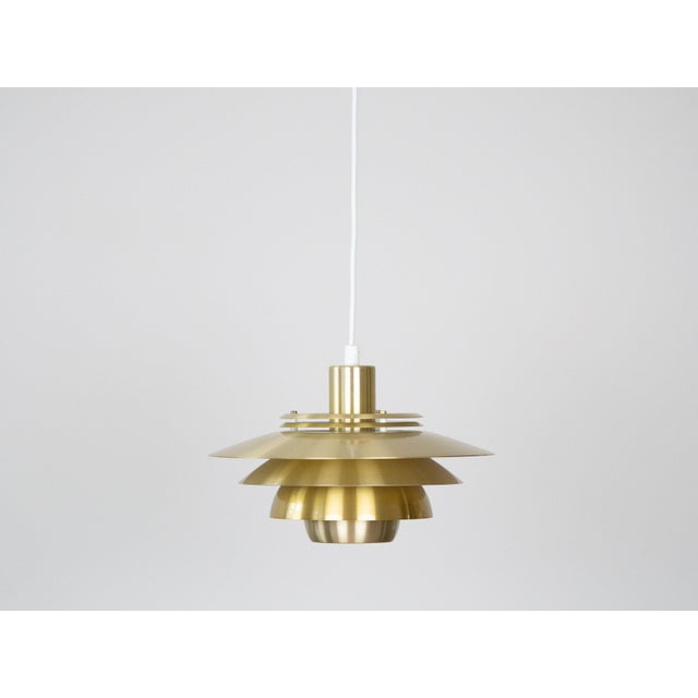 This lamp was designed by Danish designer Kurt Wiborg and manufactured by Jeka. The lamp's form is based on the principle...
