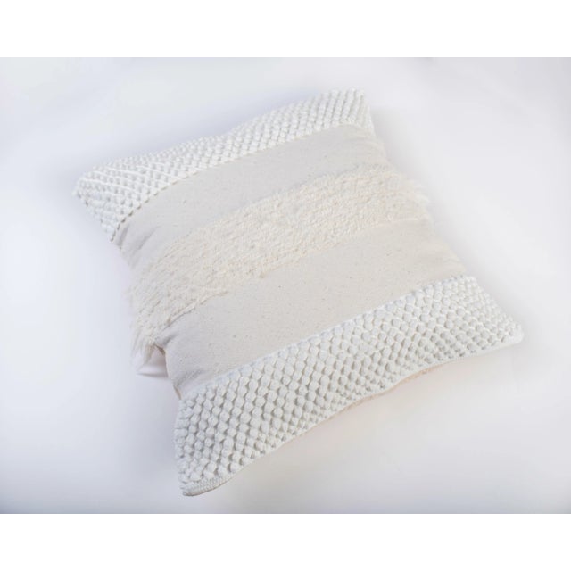 The Furry Mushroom cover pillow in white is made of recycled cotton and linen from the waste of home textile products. As...