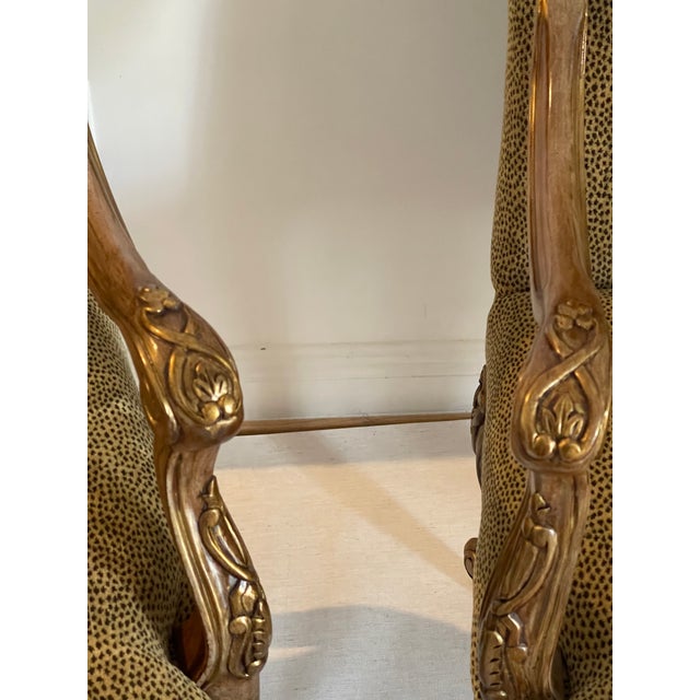 Impressive pair of large recliners in cheatah velvet with gold patinated wood finish.