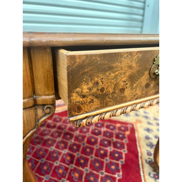 A fantastic stunning pair of matchbook burl side tables with each having a single drawer and sitting on ball and claw...