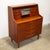 This gorgeous teak secretary desk has a hidden drop-down mirror / vanity in the center panel! Six small drawers at the top...