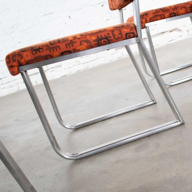 Mid-Century Modern Art Deco to Streamline Modern Railroad Dining Car Chairs in Stainless Steel & Orange Abstract Upholstery For Sale - Image 3 of 12