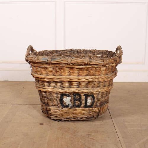 Early 20th Century French wicker champagne grape basket. Would make a wonderful log baskets due to it's heavy quality....