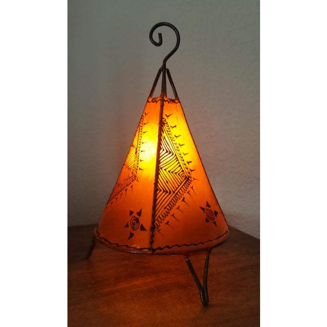 A radiant piece of Moroccan artistry, this handmade henna lamp brings the warmth of the Maghreb into any space. Crafted by...